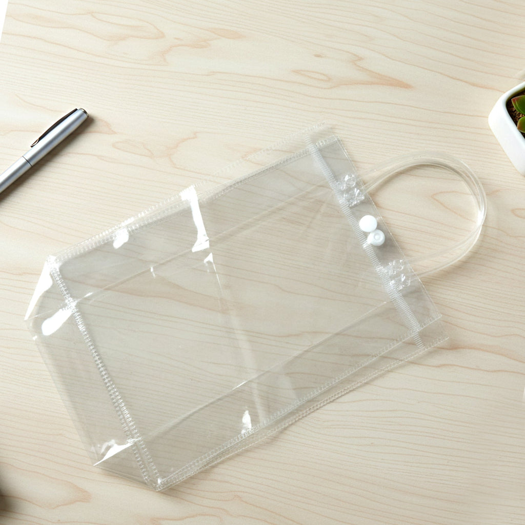 Transparent PVC carry bag 22 x 16 cm showing handle and button closure