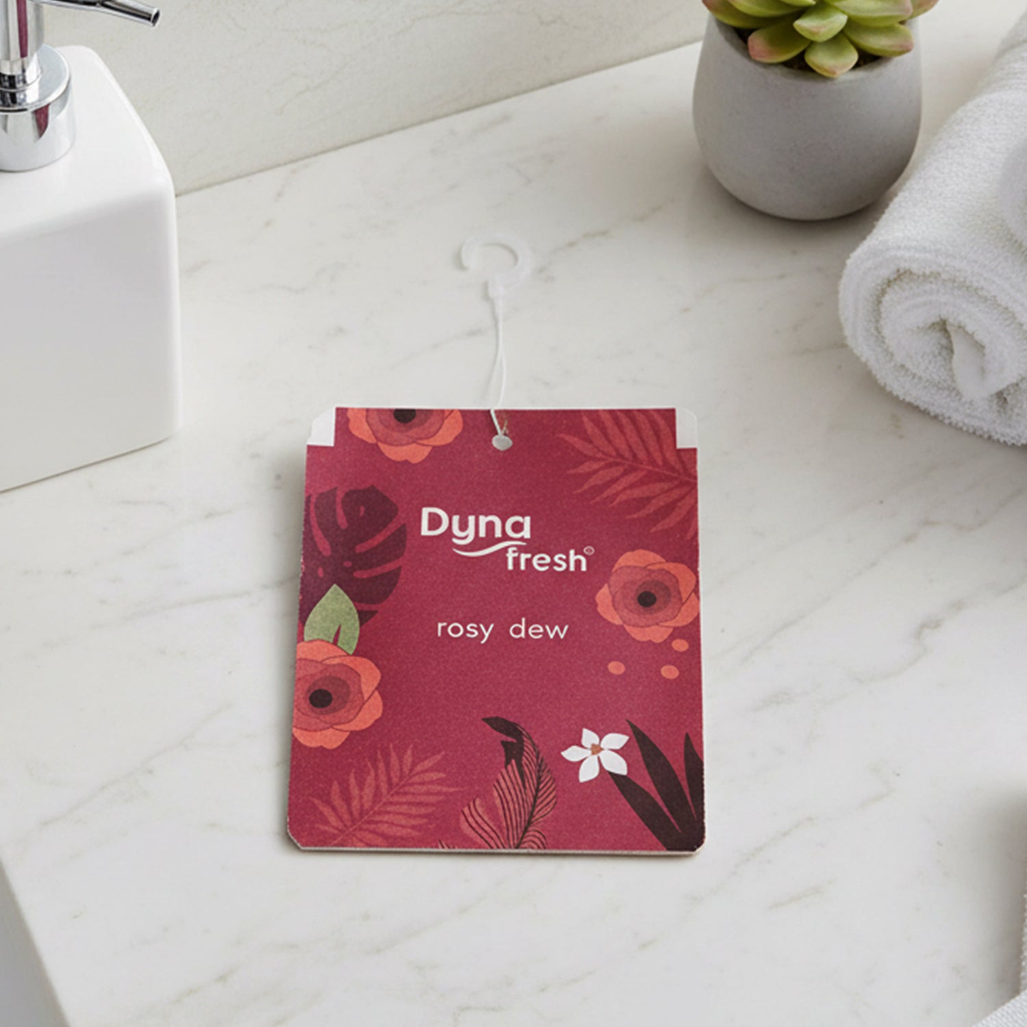Rosy Dew fragrance gel air freshener hanging in a car for a fresh driving experience.