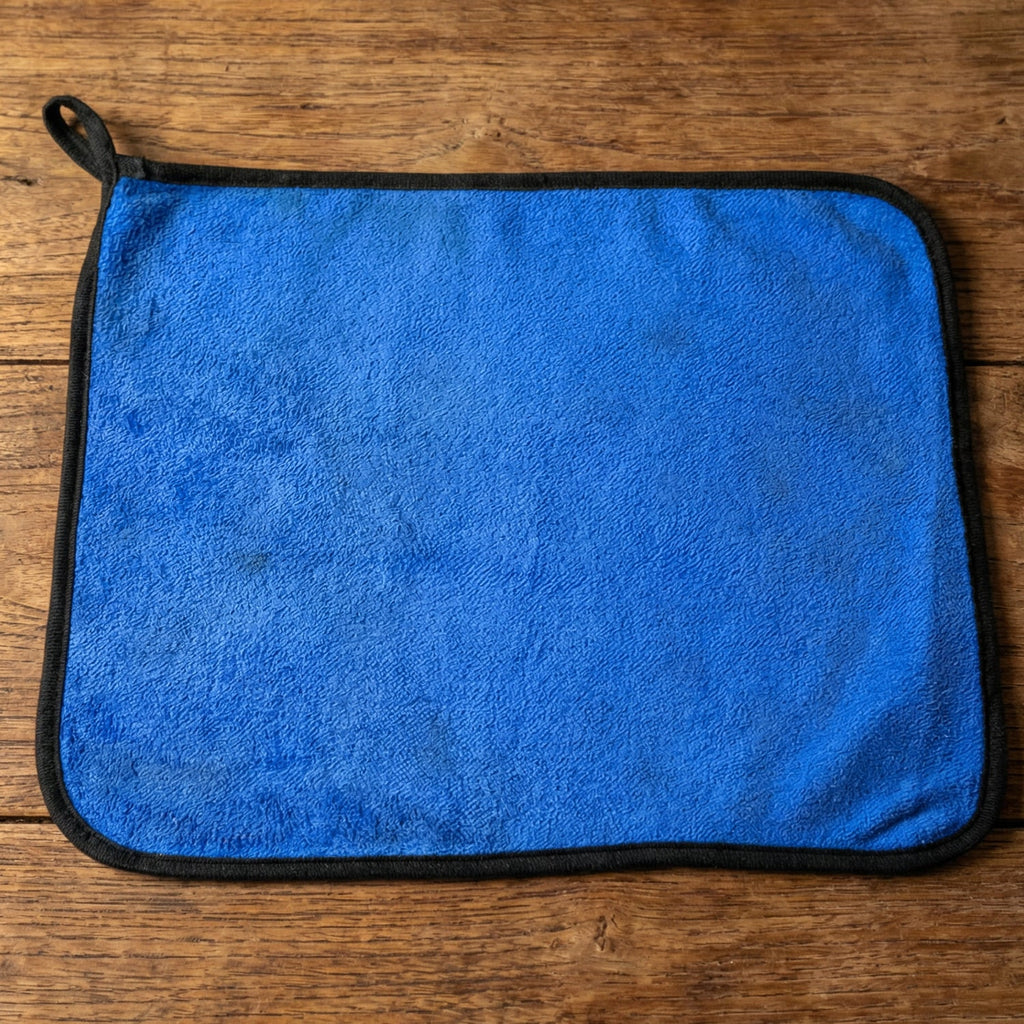 Lifestyle image of a clean glass surface wiped with microfiber cloth