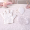 Disposable hygiene safety kit set including gloves, face mask, and shower cap in protective packaging