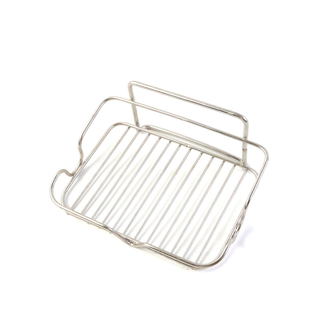 Elevated stainless steel soap stand holding bathroom essentials securely