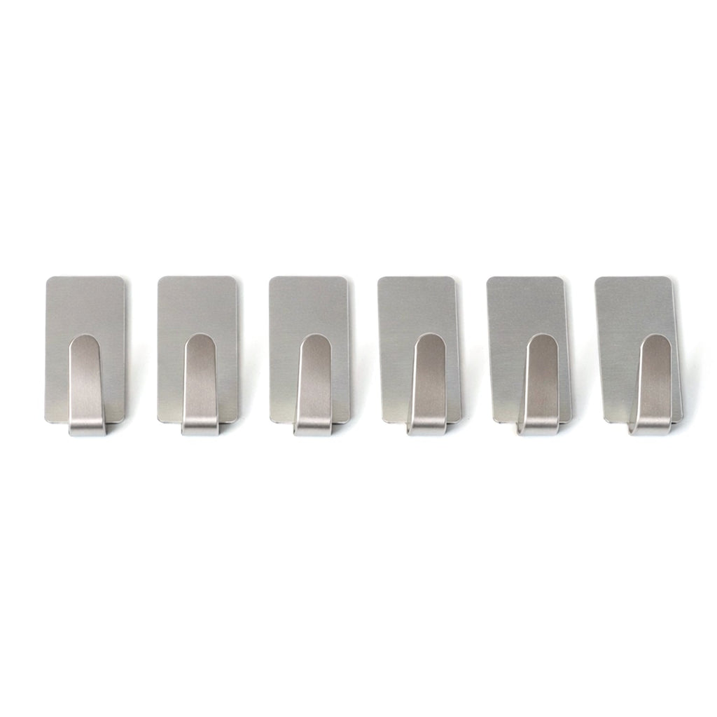 Wall hooks hanging keys and towels in home setting