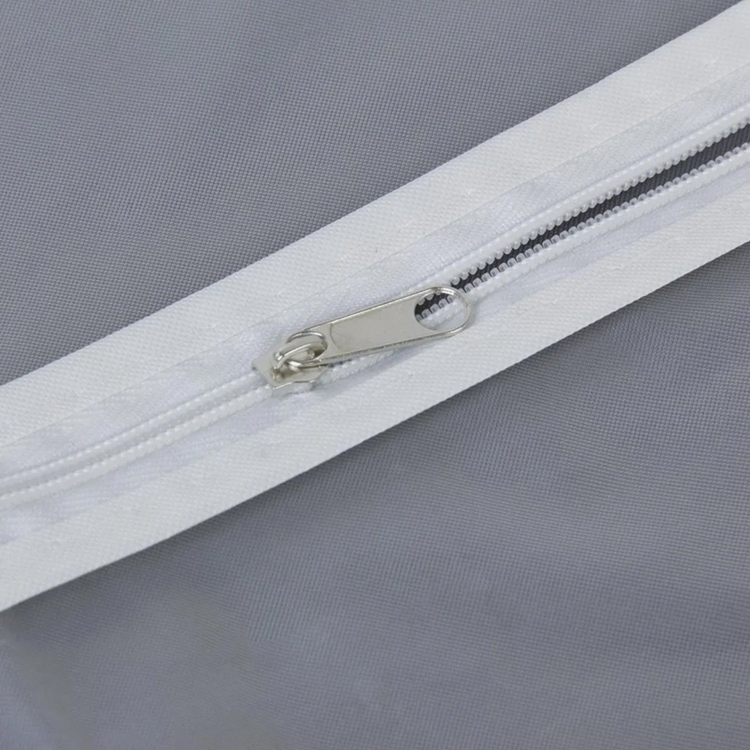 Closeup of durable full-length zipper on the breathable fabric suit cover.
