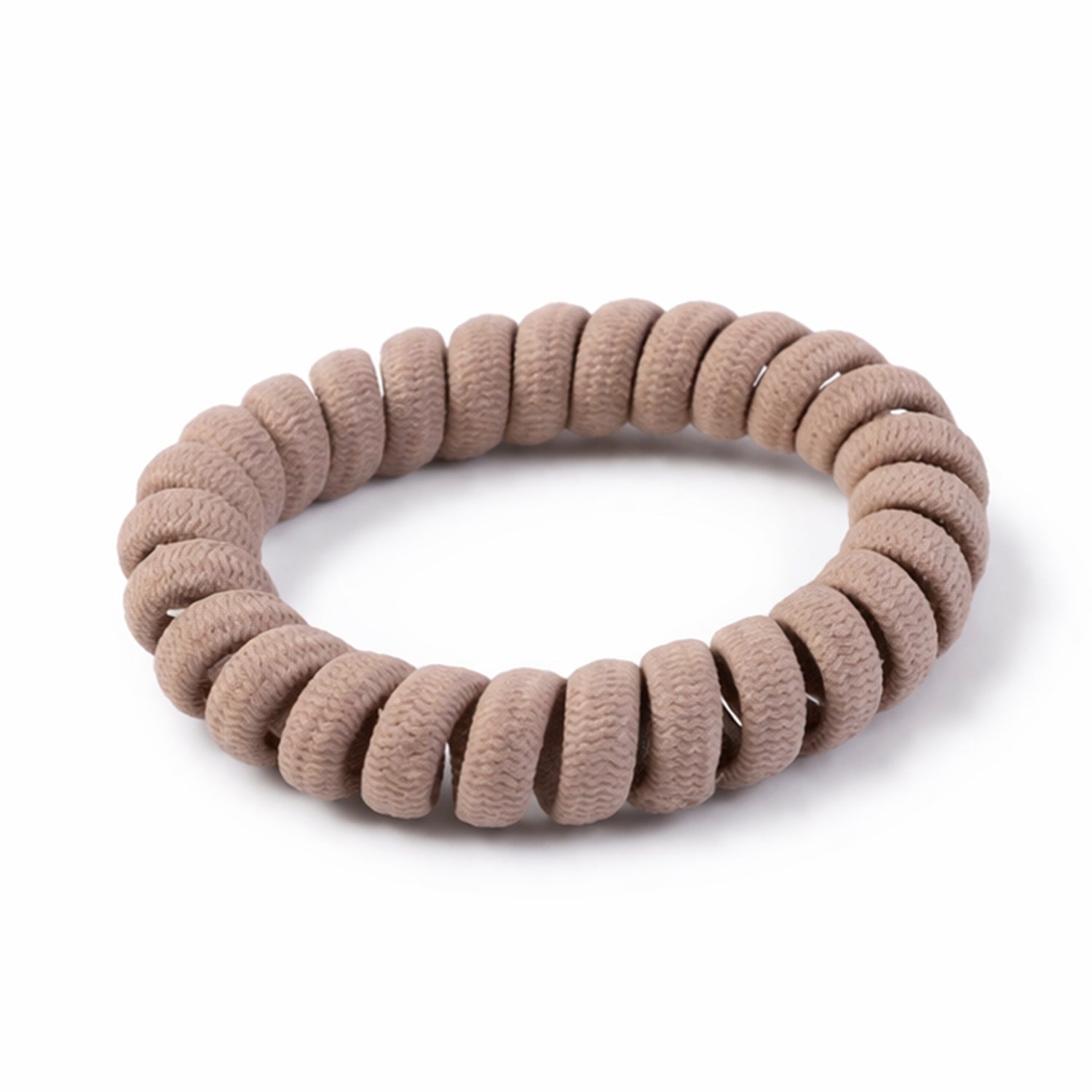 Close-up of a flexible spiral coil hair band showing its unique texture.