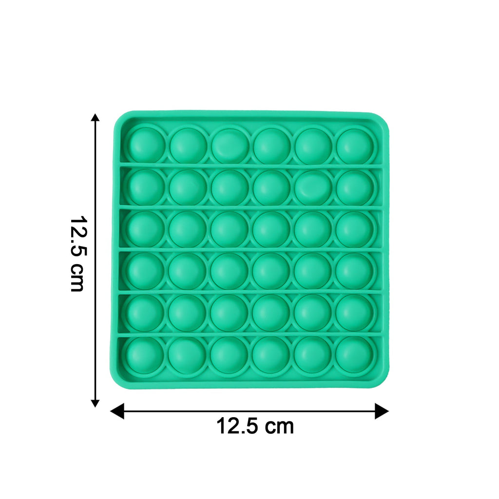 Close-up of popping bubbles on silicone Pop It toy