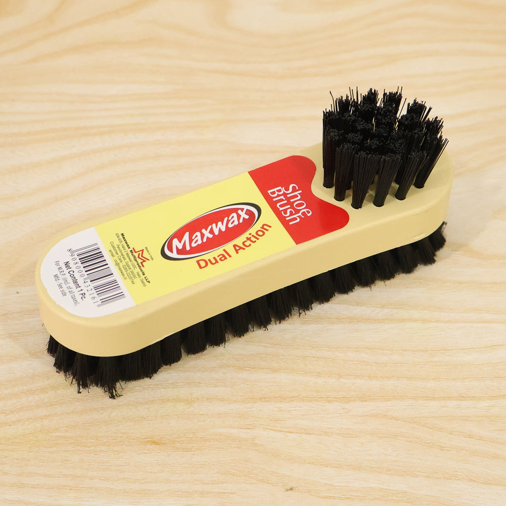 Compact cleaning brush tool ideal for both travel and convenient home use.