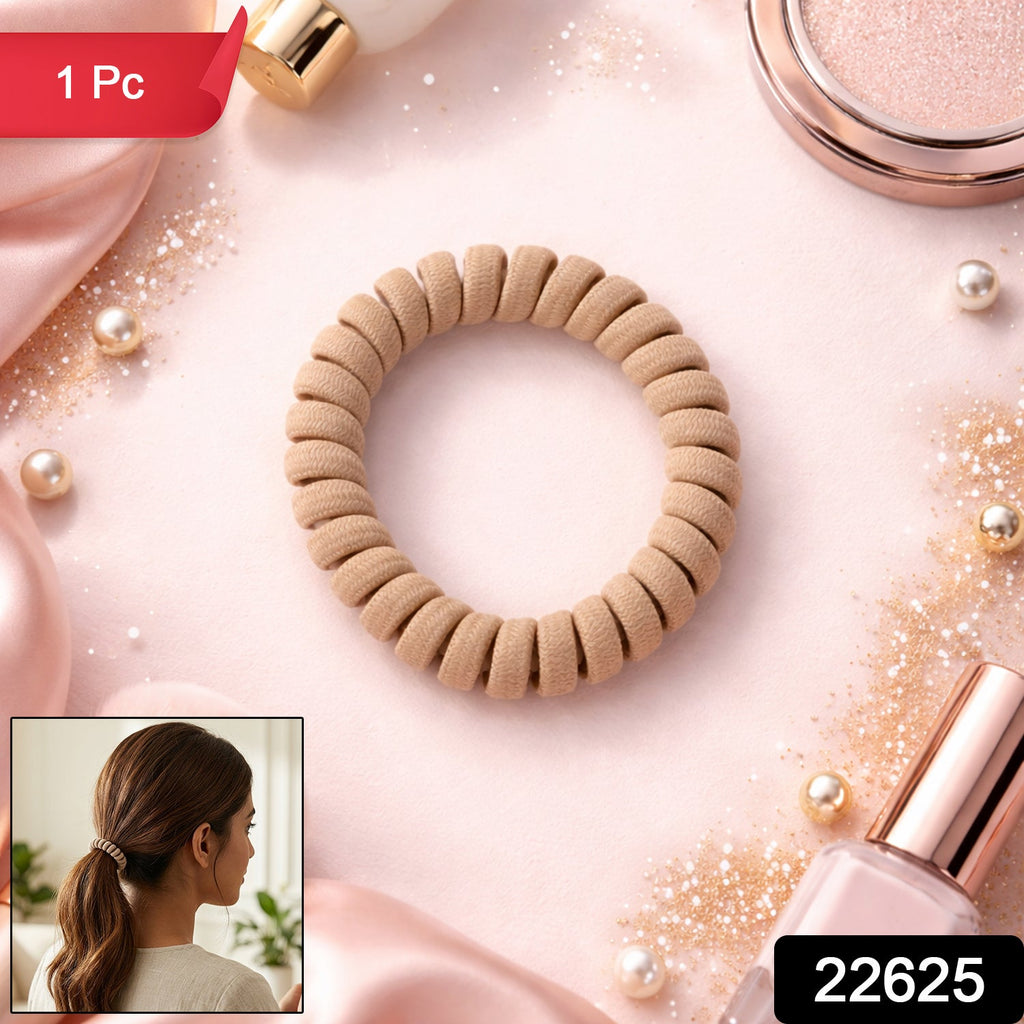 Vibrant pink spiral coil hair band, perfect for a casual style.