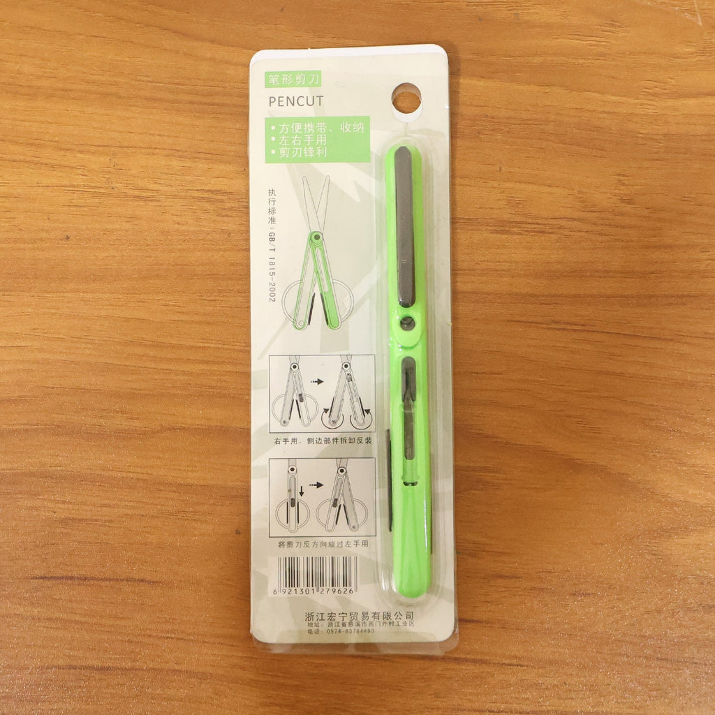 Pen-style compact scissors from FERVENT with the convenient clip attached. pen scissors