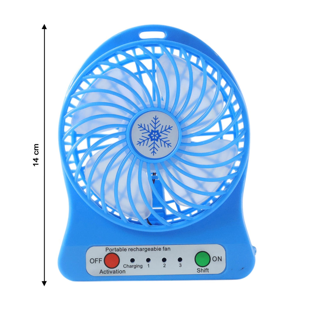Mini table fan in use at an office desk providing cool airflow