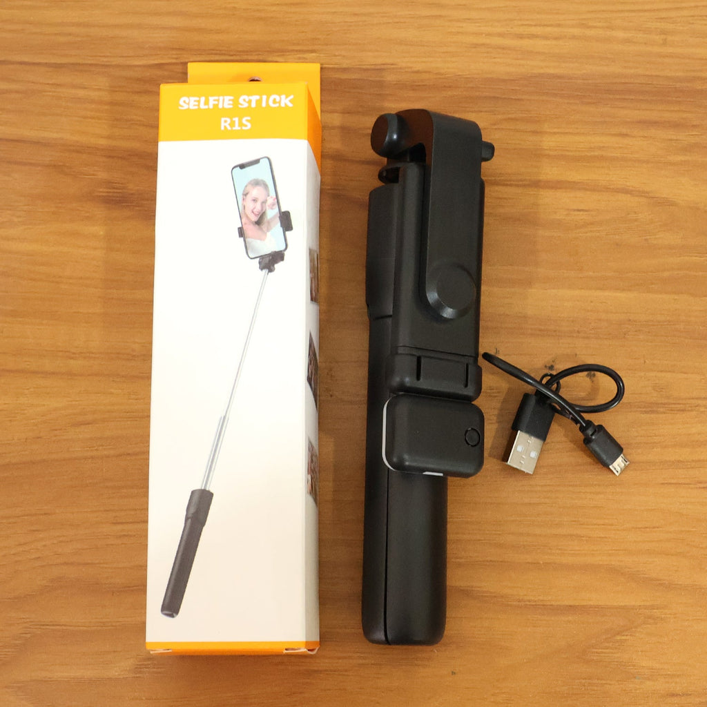 Versatile wired selfie stick with tripod stand and built-in light.