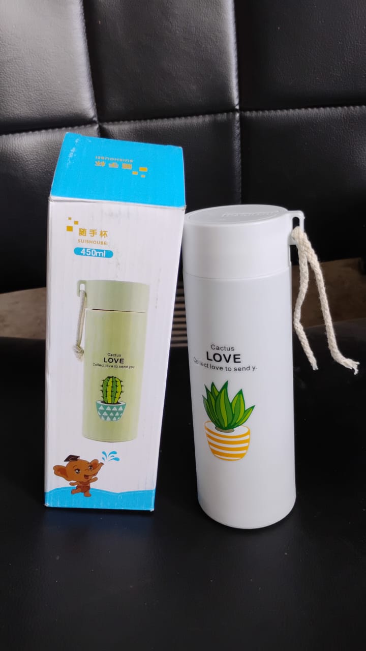 Portable borosilicate glass water bottle being used during travel, emphasizing convenience.