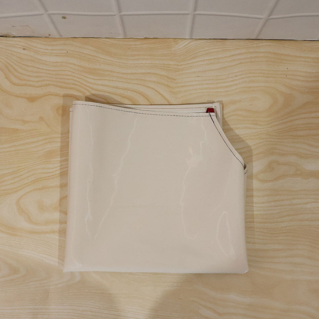 Person wearing waterproof apron while cooking in kitchen