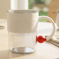Transparent plastic tea and coffee mug with ring handle and red accent