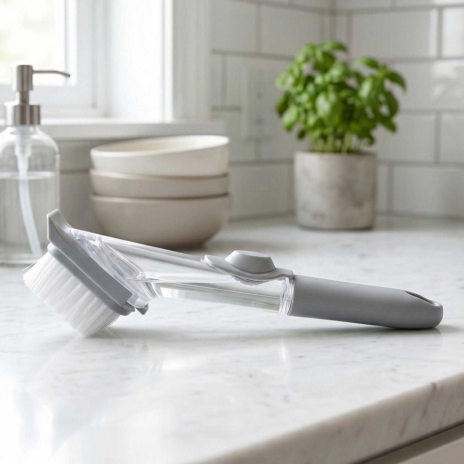 Close-up of soap dispensing mechanism on the dish scrub brush