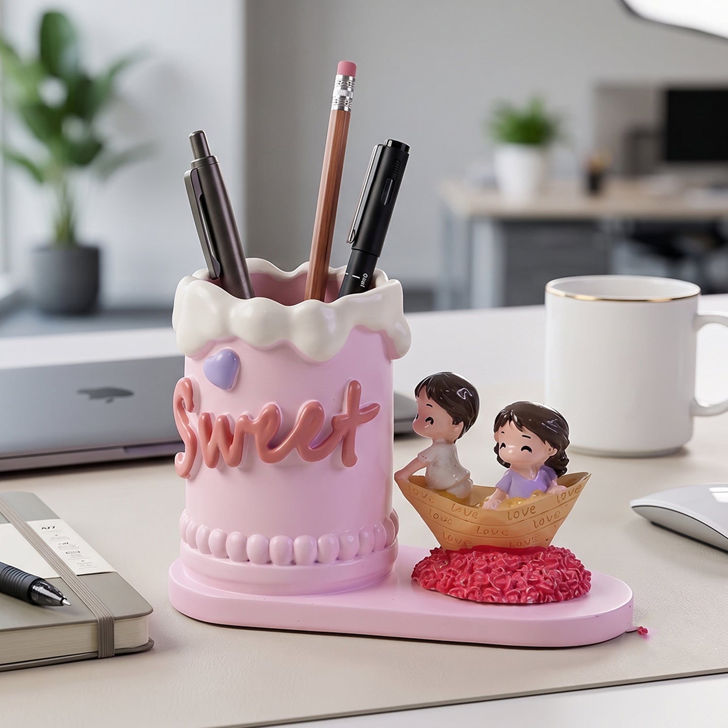Close-up of romantic couple figurine pen holder