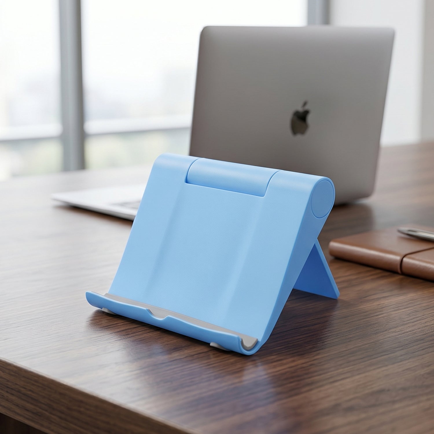 Close-up of a plastic foldable mobile phone stand showing its adjustable hinge.