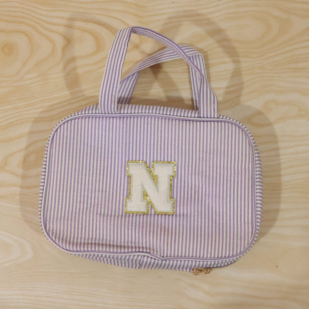Detailed view of multi-pocket toiletry pouch with compartments