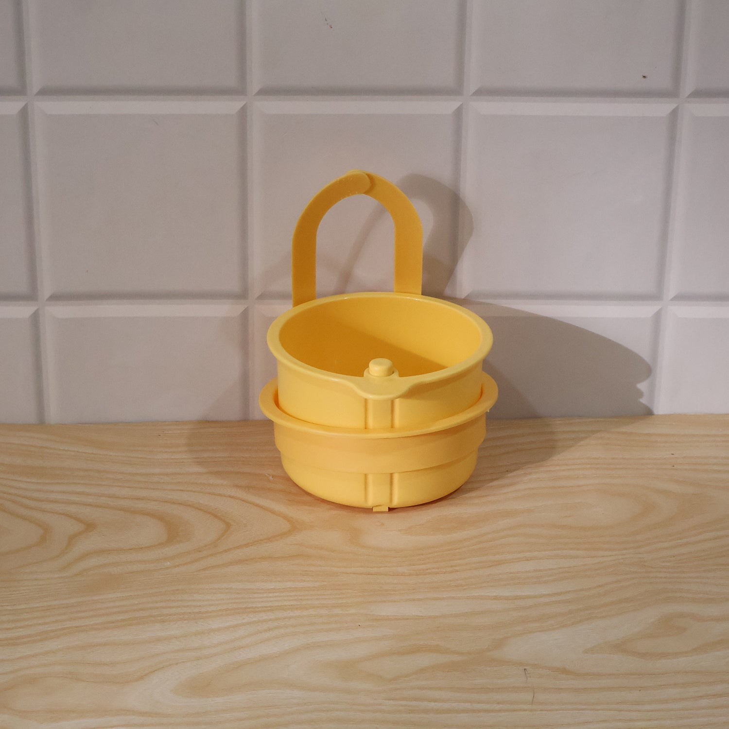Live photo of plastic hanging kitchen sink drain basket