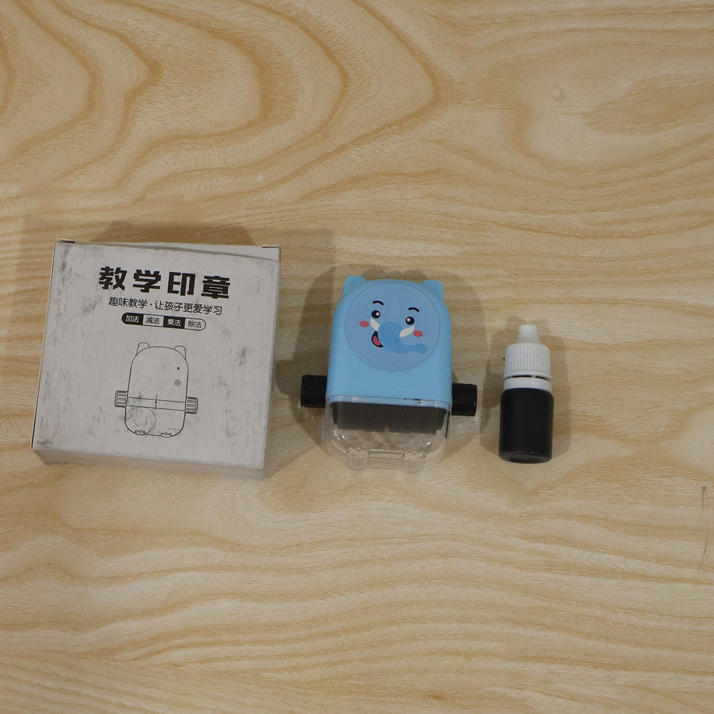 Live photo of kids multiplication roller stamp with box and ink bottle