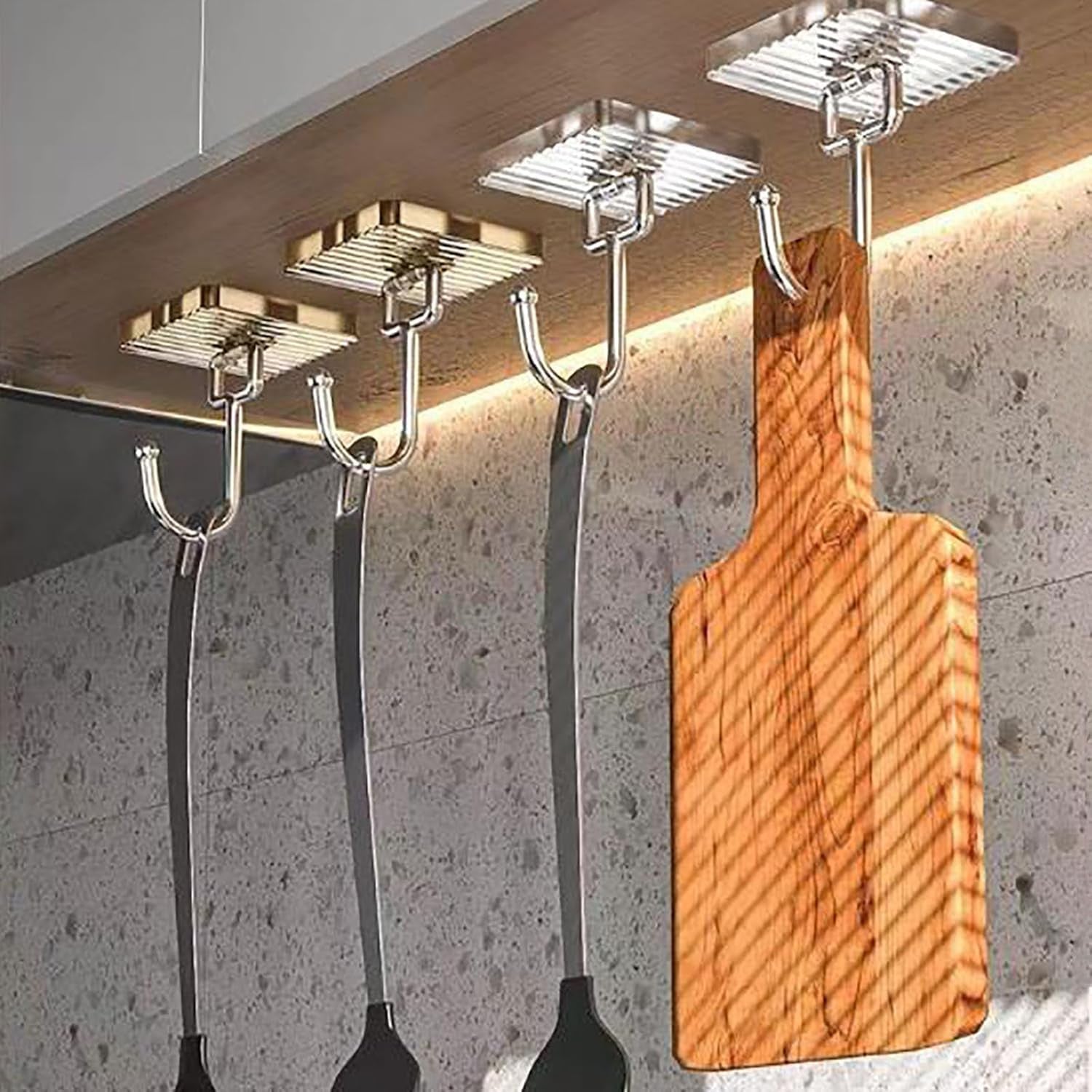 Adhesive hook holding keys and bags for home organization