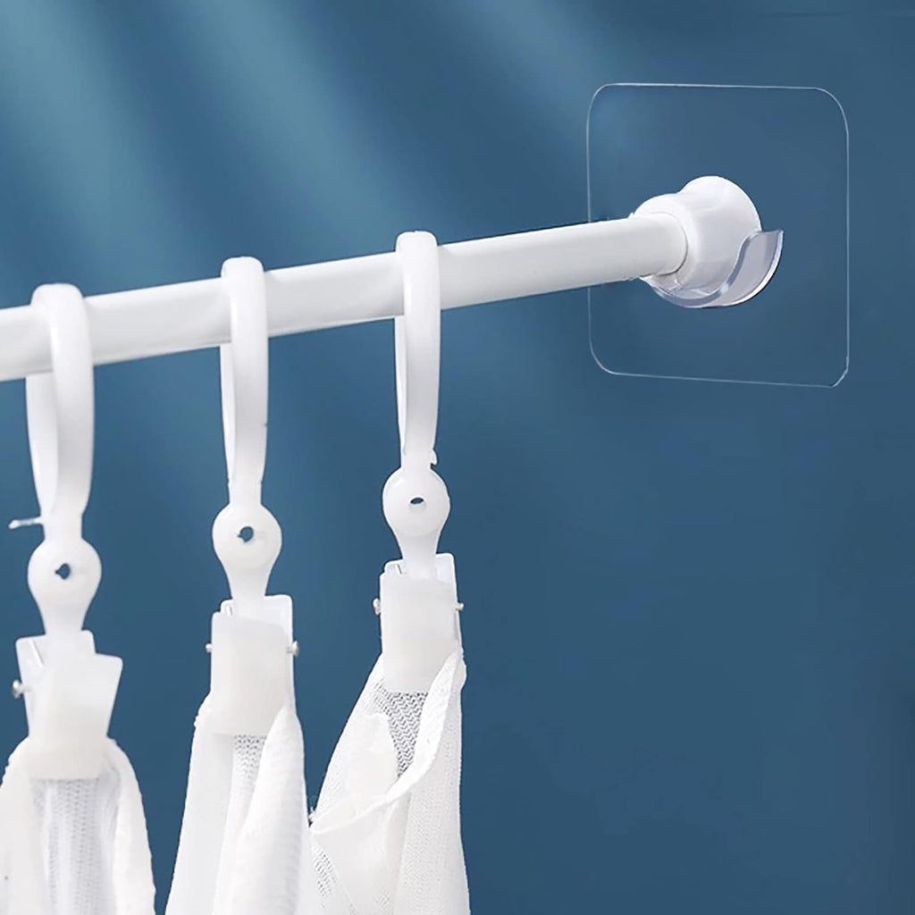 Adhesive curtain rod holder in use on wall for curtains or towels