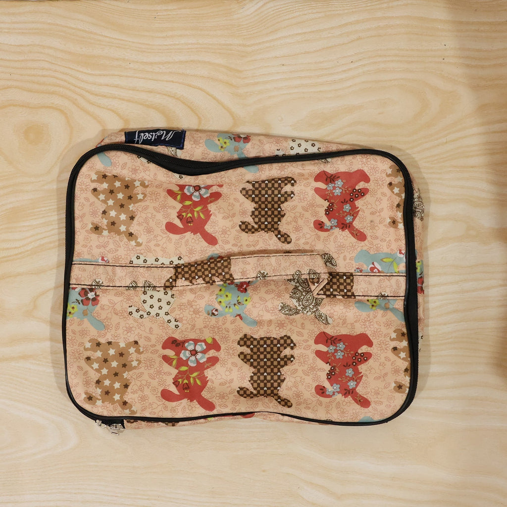 Person holding a compact travel organizer bag, ready for daily use.