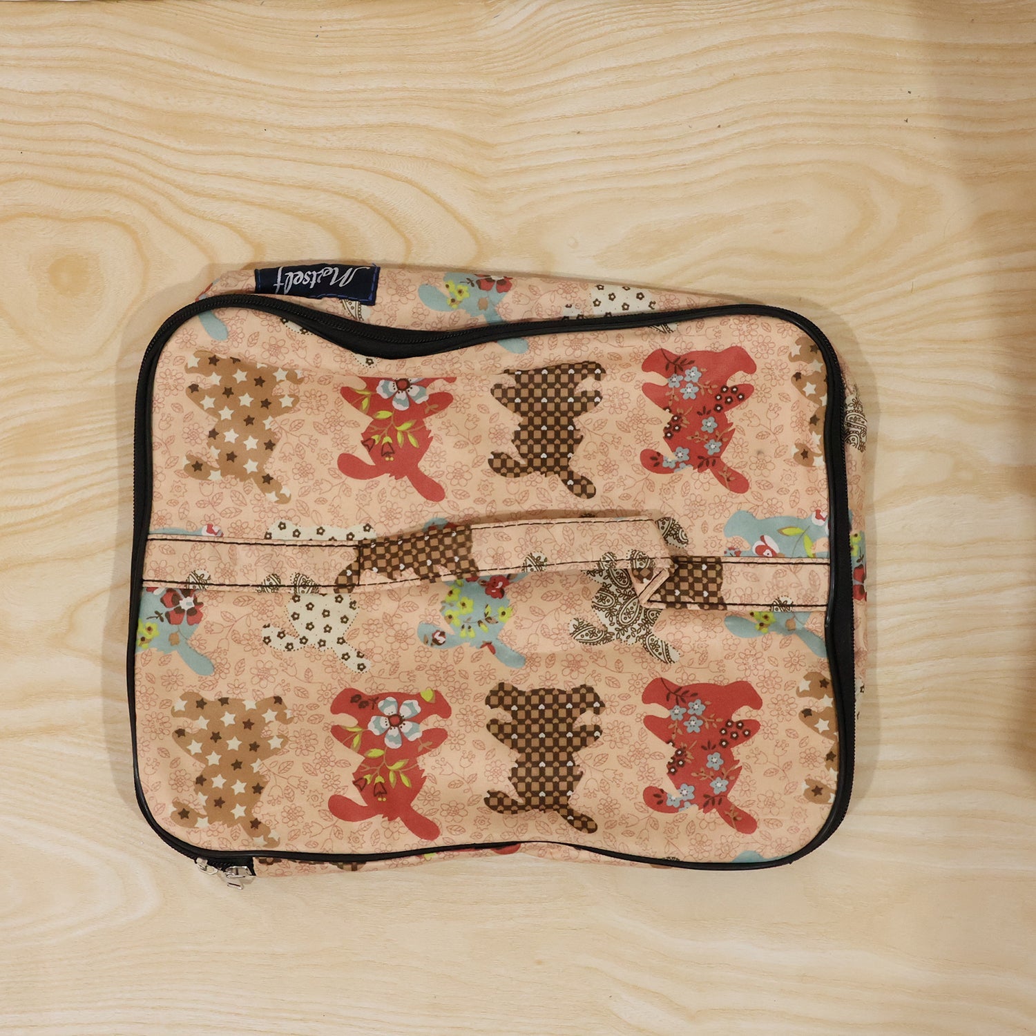 Person holding a compact travel organizer bag, ready for daily use.