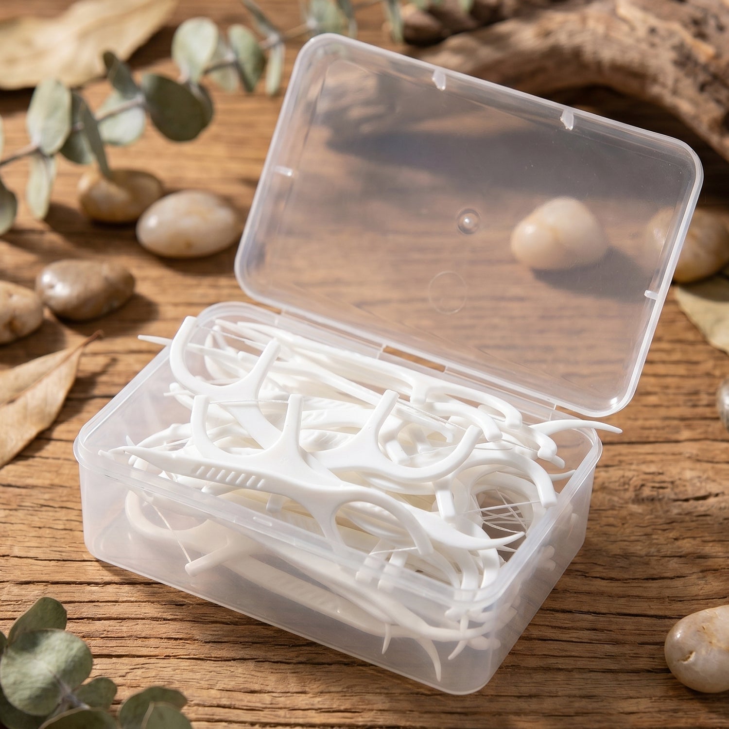 Portable case holding white dental floss & toothpick sticks