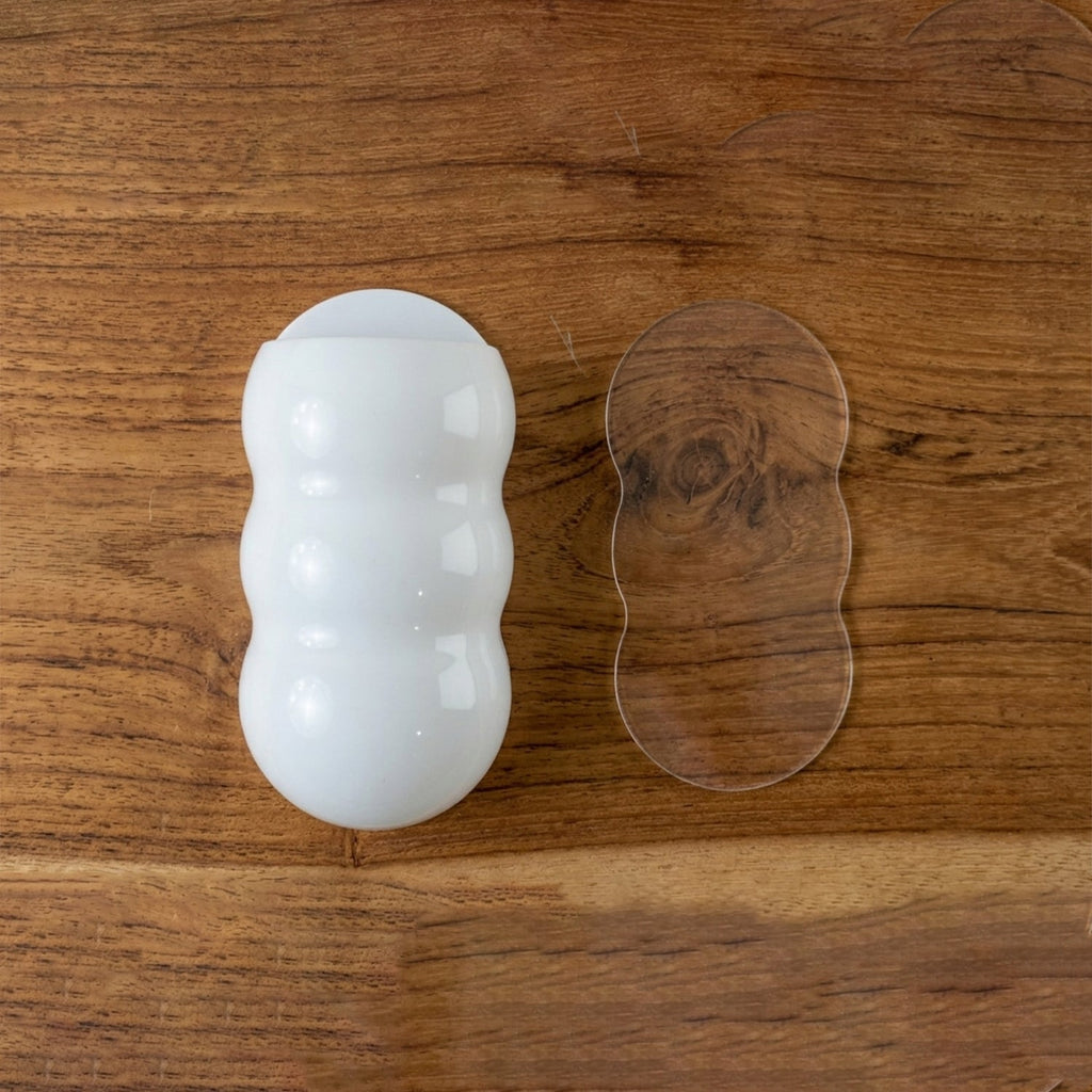 Caterpillar shape plastic storage holder with clear adhesive mounting pad