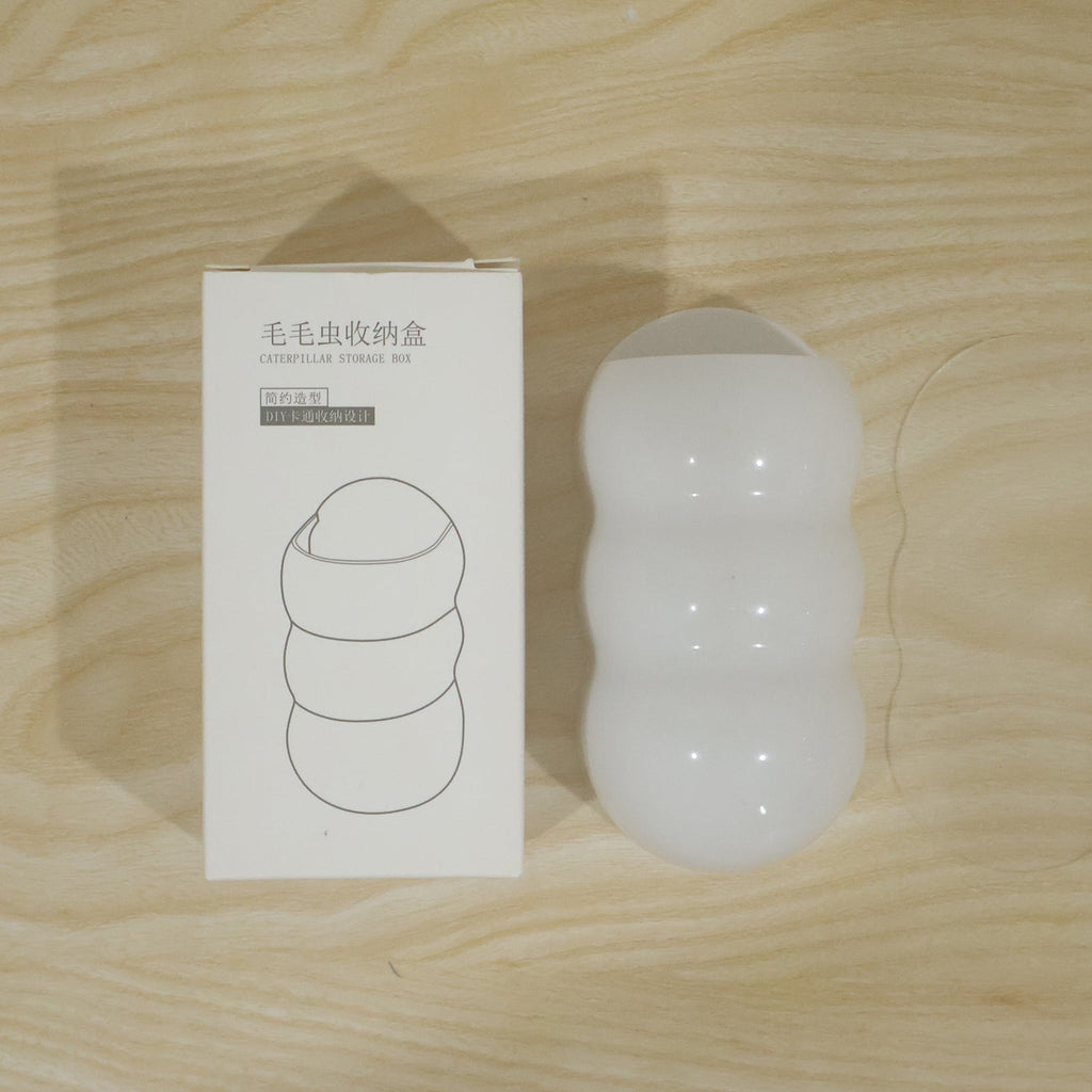 Live photo of caterpillar storage box with color box packaging and adhesive pad