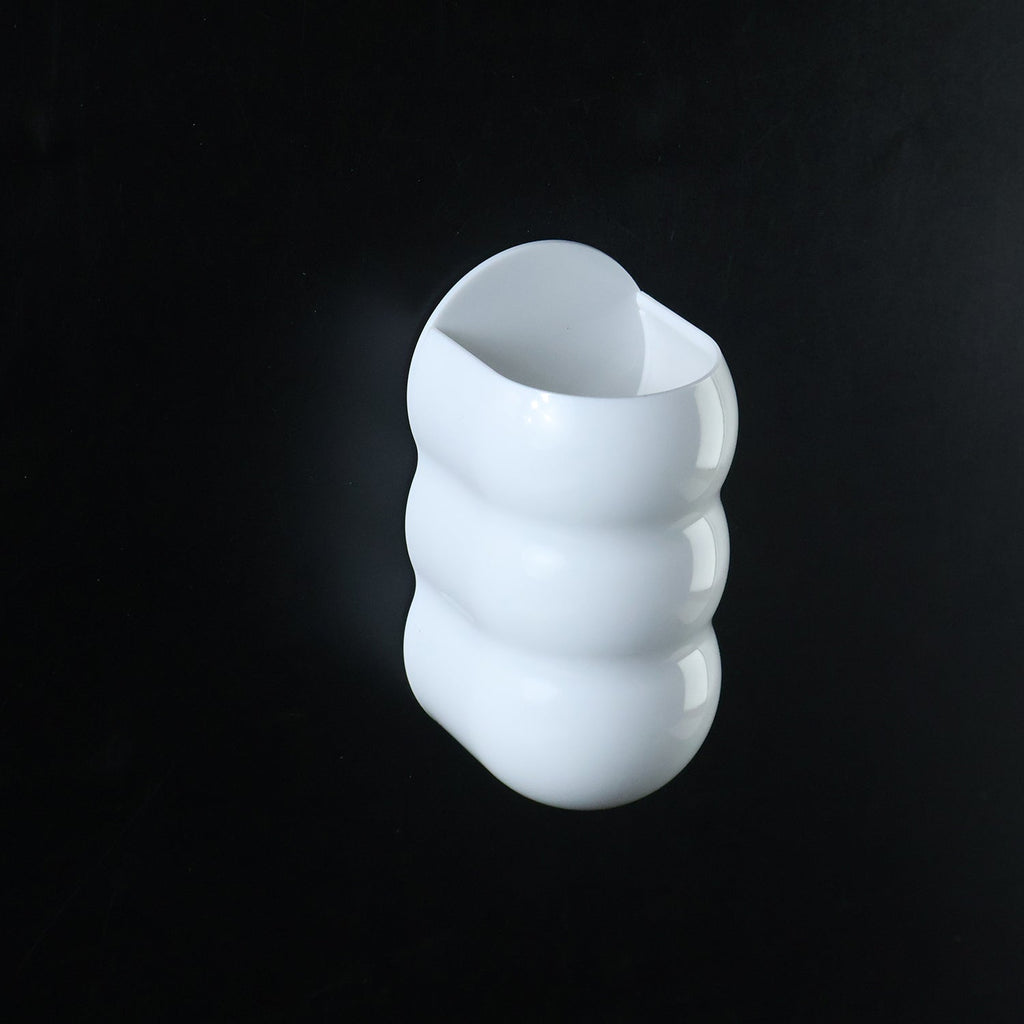 White plastic caterpillar shape wall storage holder side view