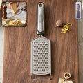 Stainless steel cheese grater with plastic handle for versatile kitchen use
