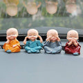 Baby Buddha 4-piece statue set displayed for home decoration