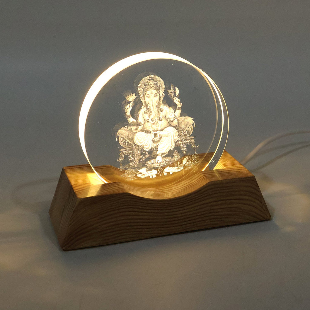 3D Lord Ganesha LED lamp emitting warm light in dim room