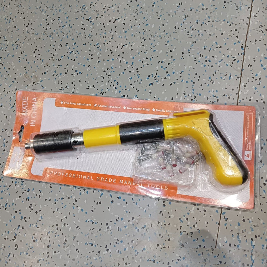 Live photo of manual nail gun tool set with nails