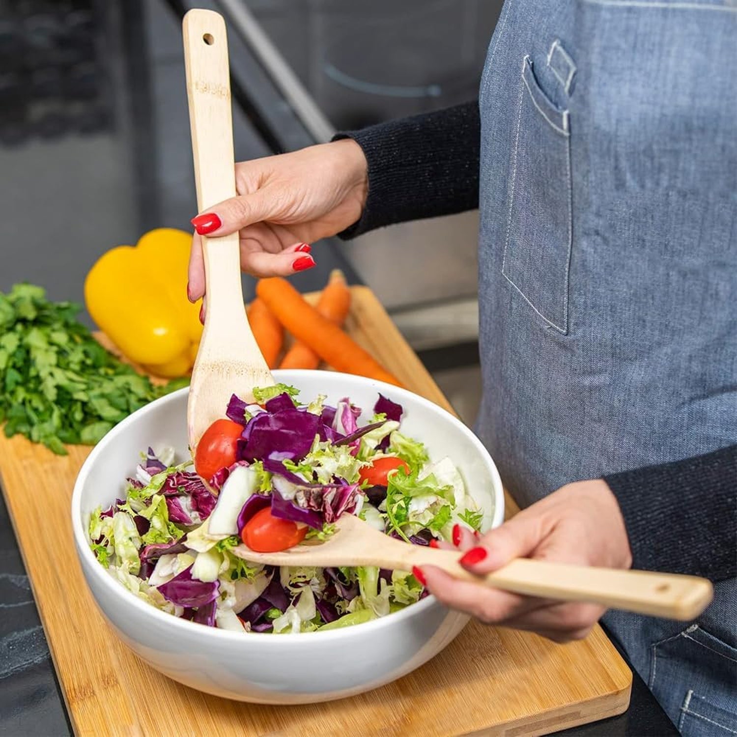 Wooden chopping board and bamboo utensil set for the kitchen
