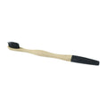 Bamboo toothbrush with soft charcoal bristles on a wooden handle