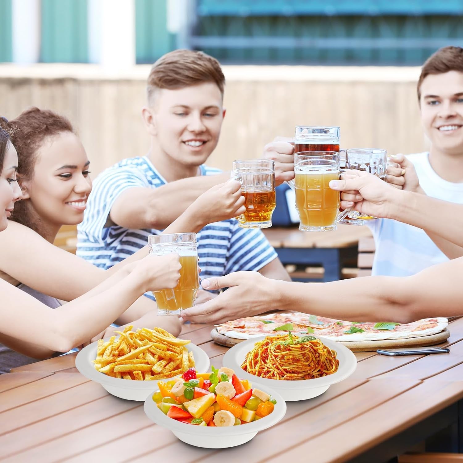 Disposable bowls filled with soup and salad for serving