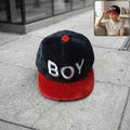 Boys printed fashion cap with letter design showing stylish casual headwear