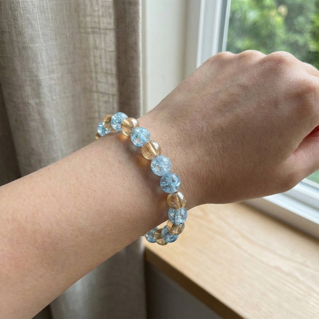 Angle view of stylish dual-tone beaded stretch bracelet