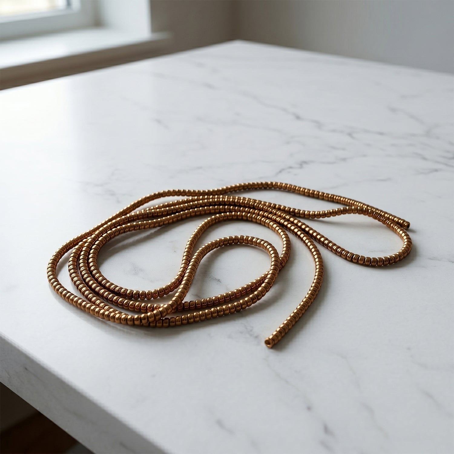Durable brown spiral cable protector sleeve for keyboard and USB wires.