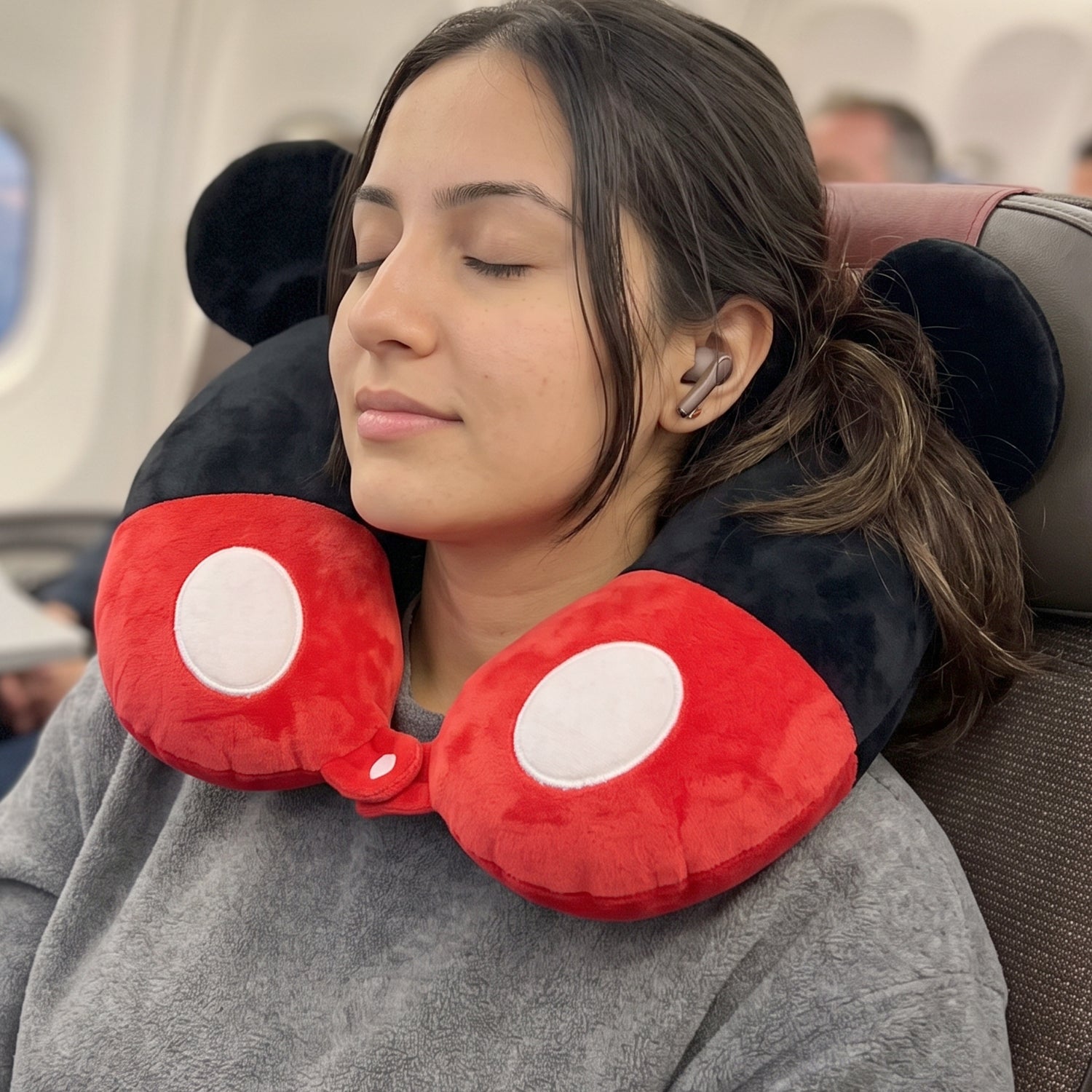 Soft plush pillow with ears for flights and road trips