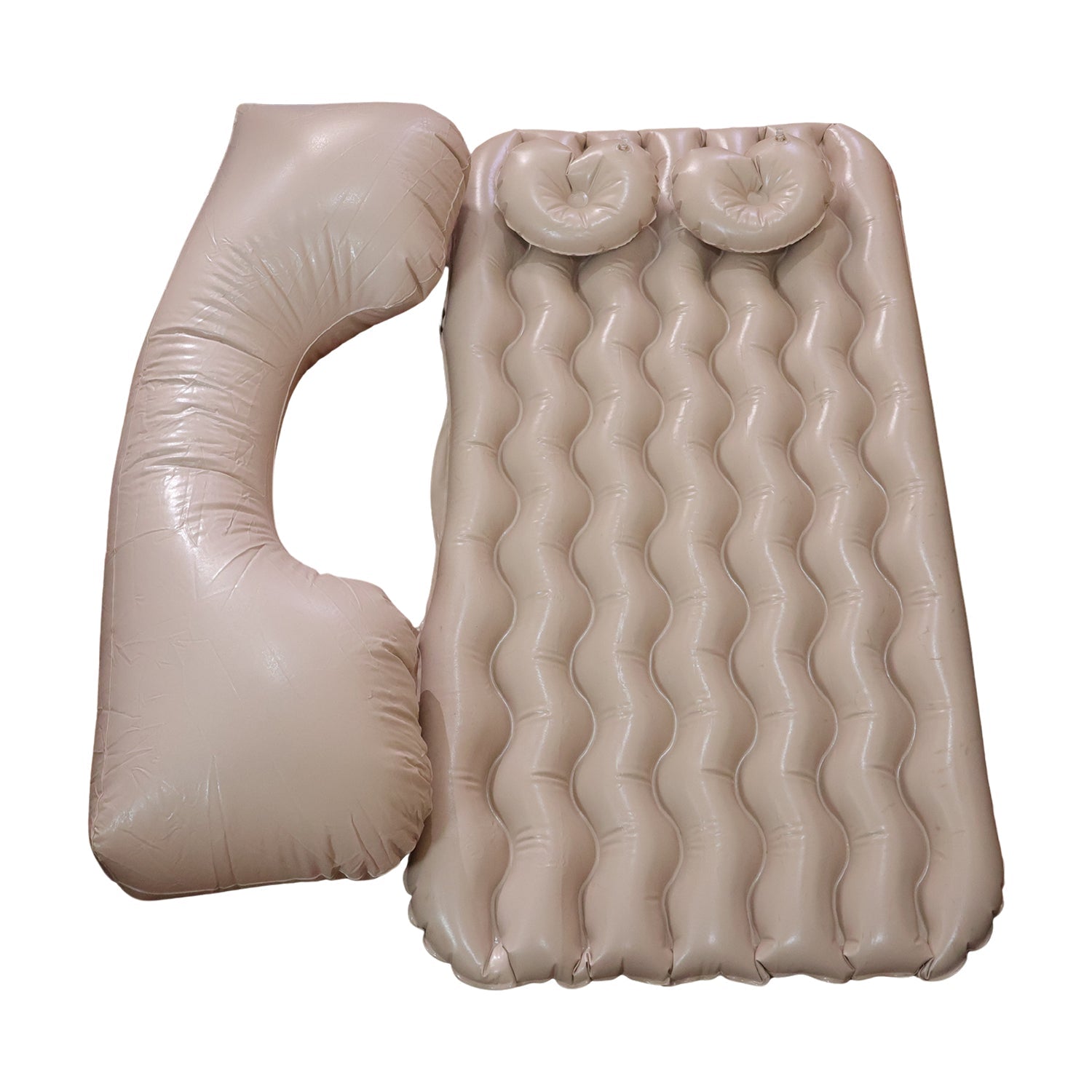 Inflatable car air mattress installed in back seat with pillows.