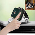 Car shaped mobile phone holder stand on an office desk