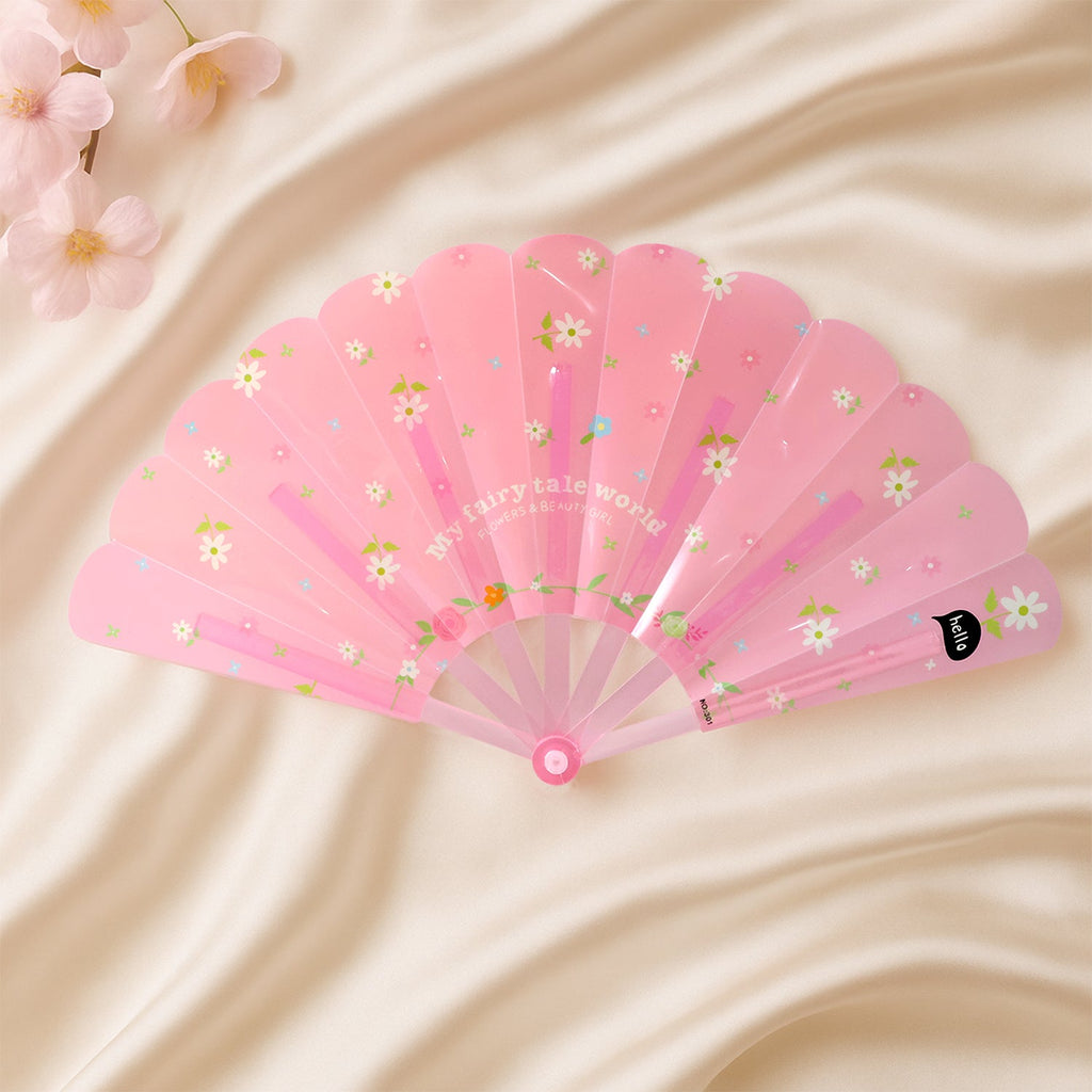 Floral hand fan resting elegantly on a table