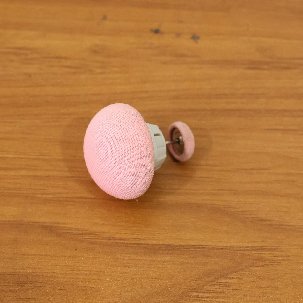 Soft Duvet Button Clip fastened on bedding in live view
