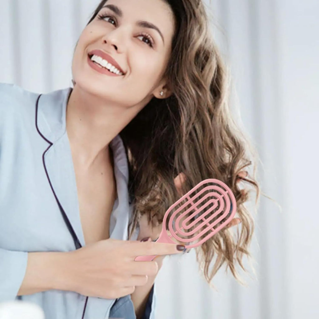 Side profile of the curved hair brush showing its unique shape.