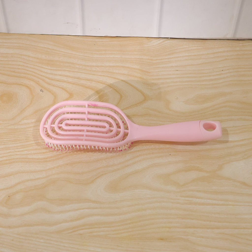 Vented design of the hair brush assisting in faster blow-drying.