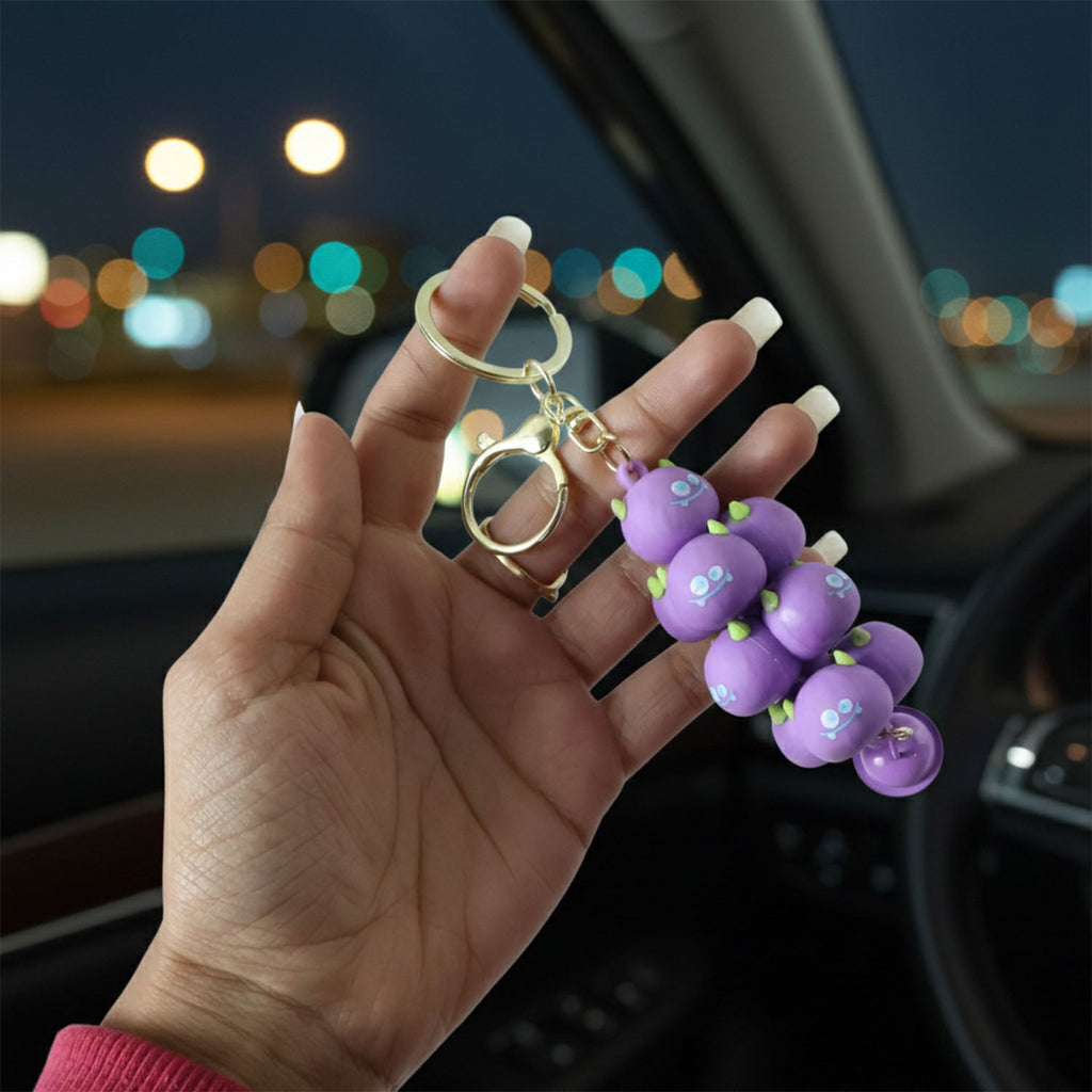 Child-friendly cartoon cloud keychain with a small bell and a metal clip.