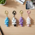 Colourful cartoon cloud keychain with a charming bell and secure metal clip.